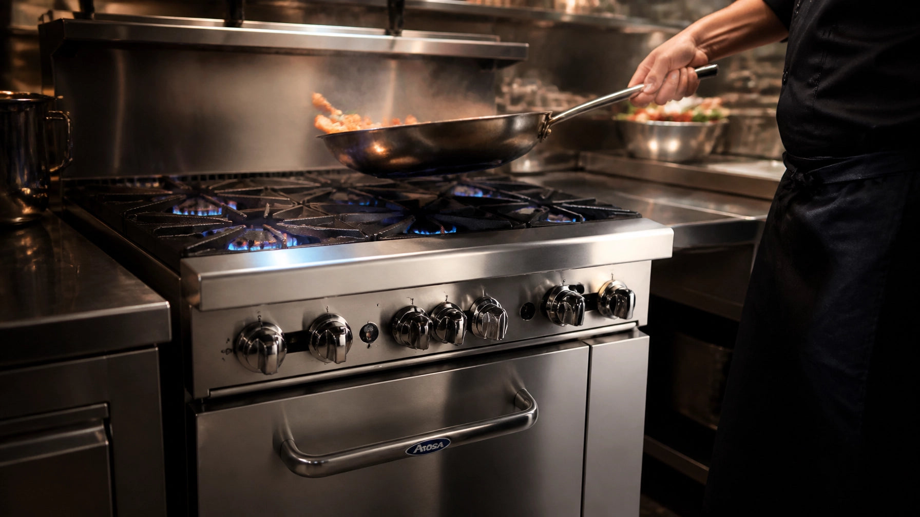 Commercial Atosa AGR gas range on a restaurant cookline with open burners lit and stockpots in service