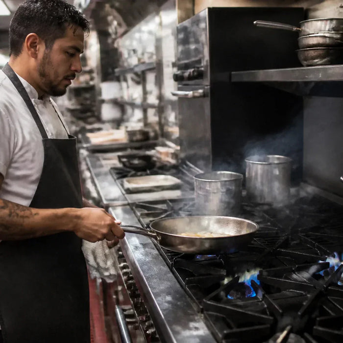 Commercial Atosa AGR 6-burner gas range with cast-iron grates and stainless steel back guard on a restaurant cookline