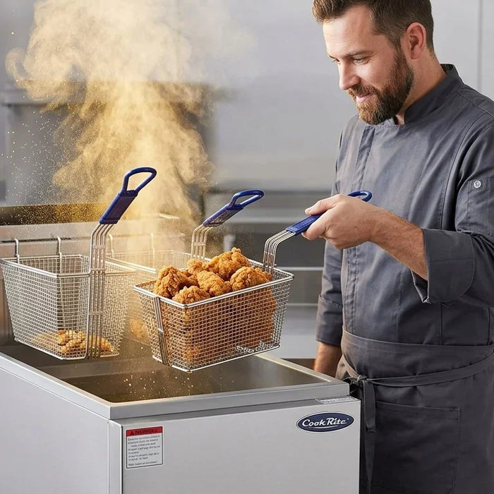 A focused chef lifting golden-brown fried chicken from a professional CookRite deep fryer in a clean commercial kitchen