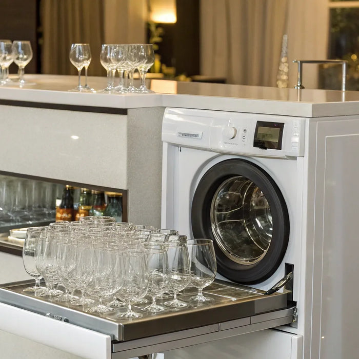Commercial bar glass washing machine with a rack of clean glasses.