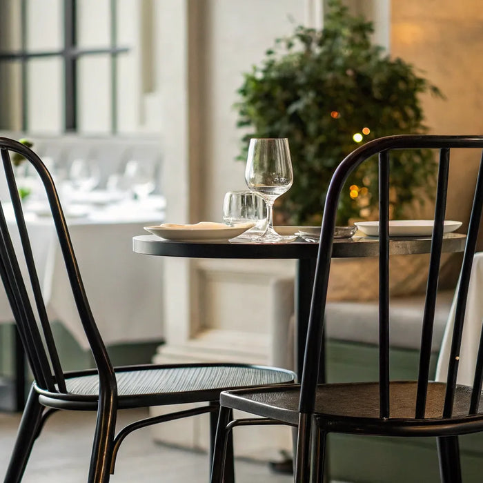 Sleek black metal chair.