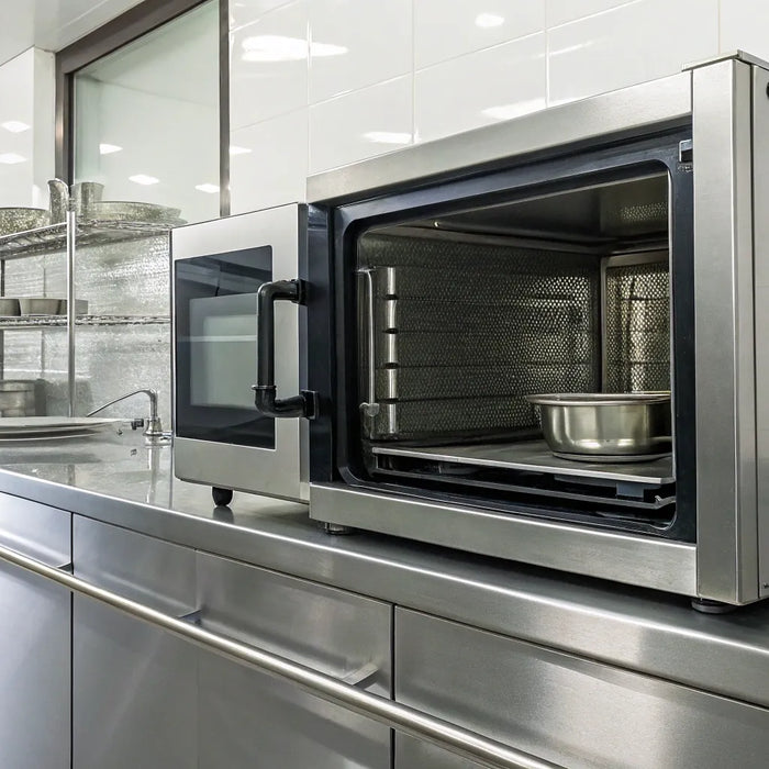 Commercial microwave in a restaurant kitchen.