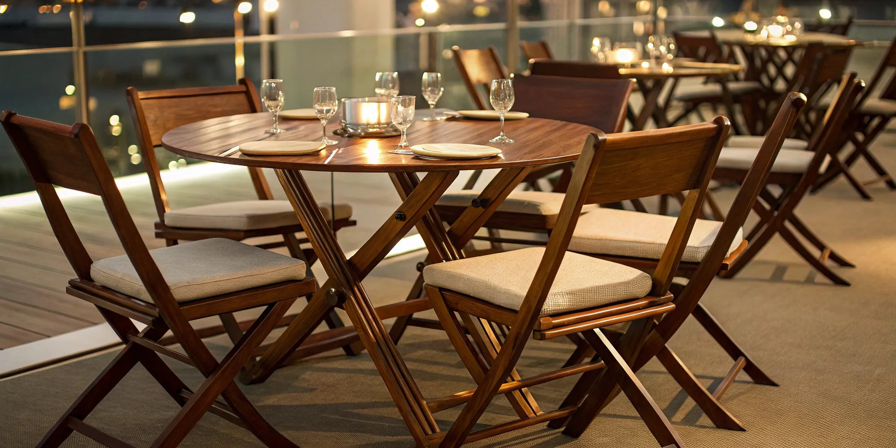 Wooden folding chairs at an outdoor dining table.