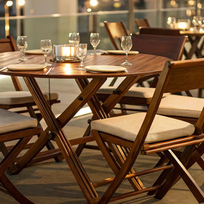 Wooden folding chairs at an outdoor dining table.