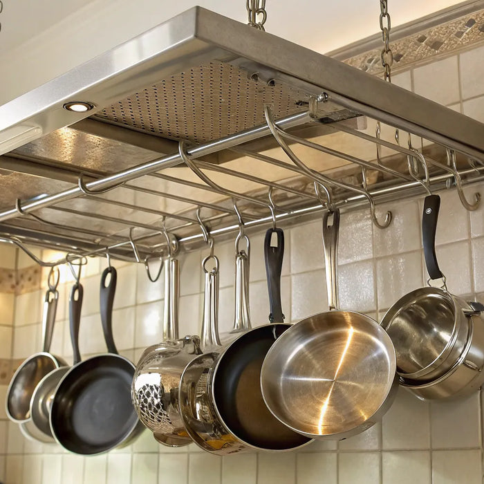Pots hanging from a ceiling pot rack.