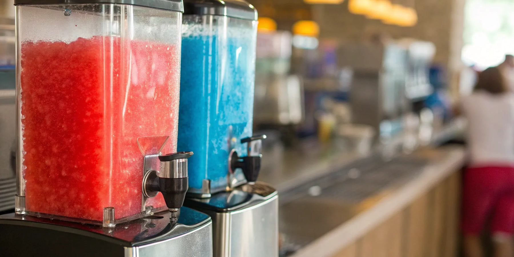 Red and blue slushies in a commercial slushy machine.