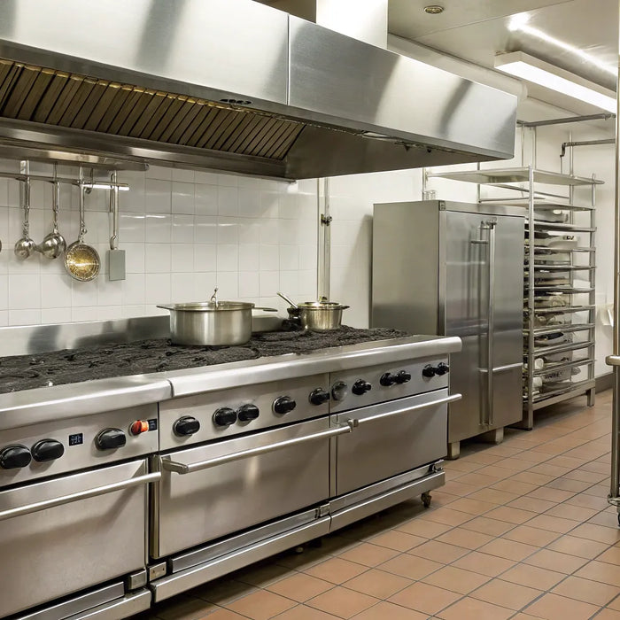 Industrial kitchen equipment: stove, storage, and prep areas.