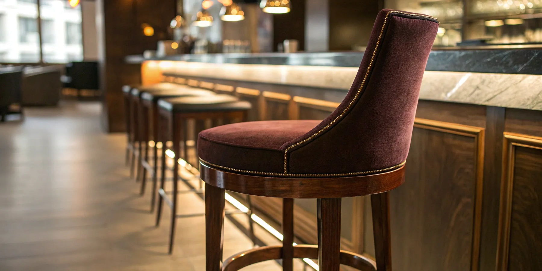 Restaurant bar stool with upholstered back and seat.