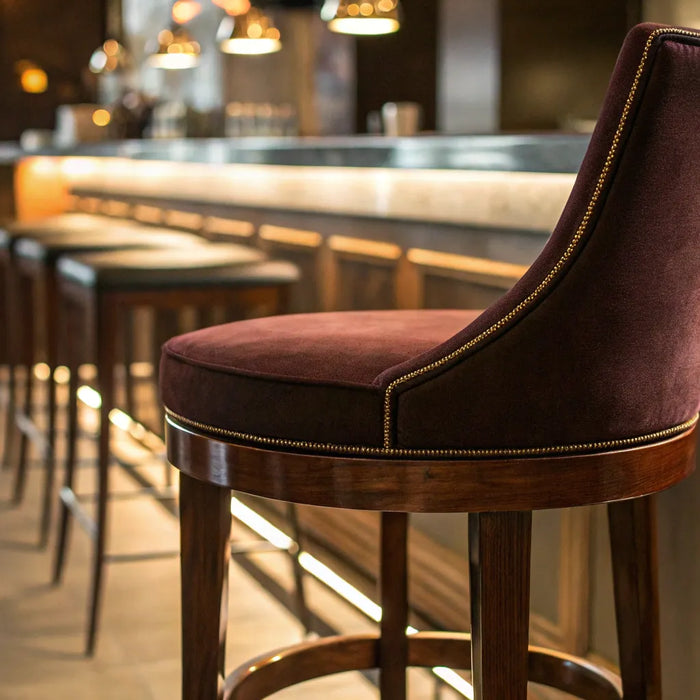 Restaurant bar stool with upholstered back and seat.