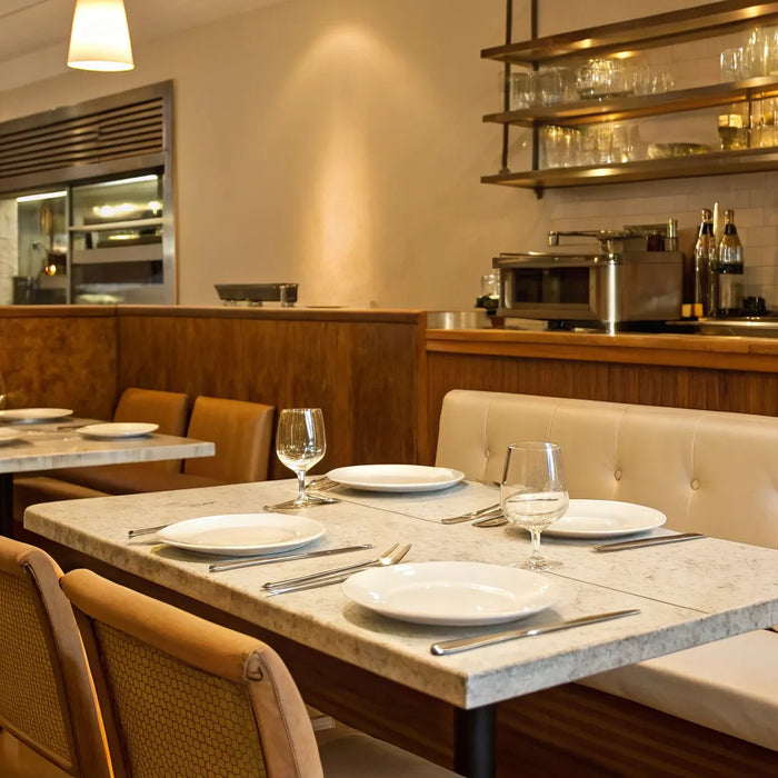 Restaurant interior with upscale seating and lighting.