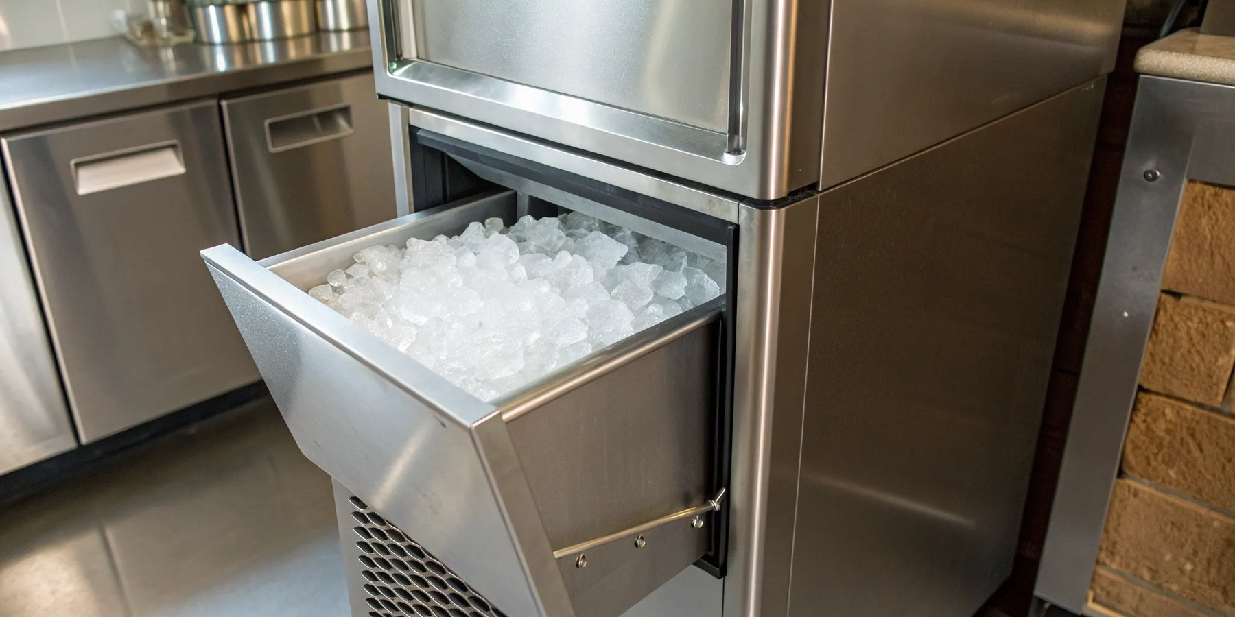 A commercial ice machine bin full of clean, cubed ice.