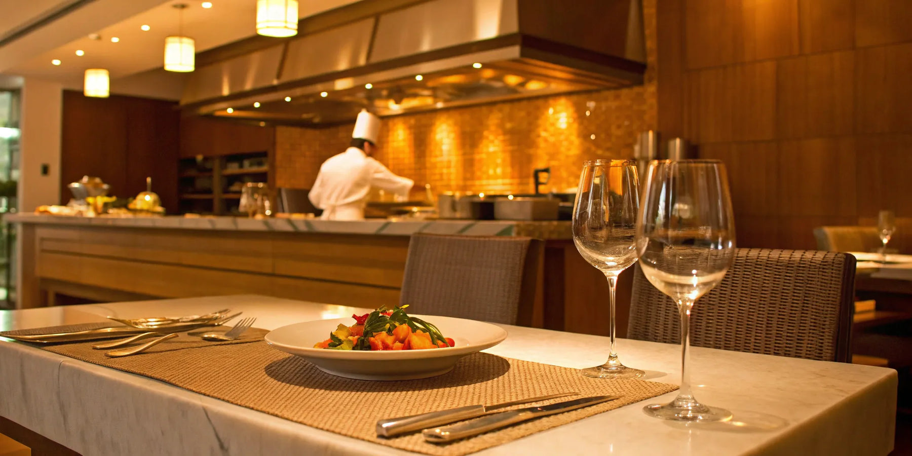Chef prepares a dish in a restaurant kitchen.