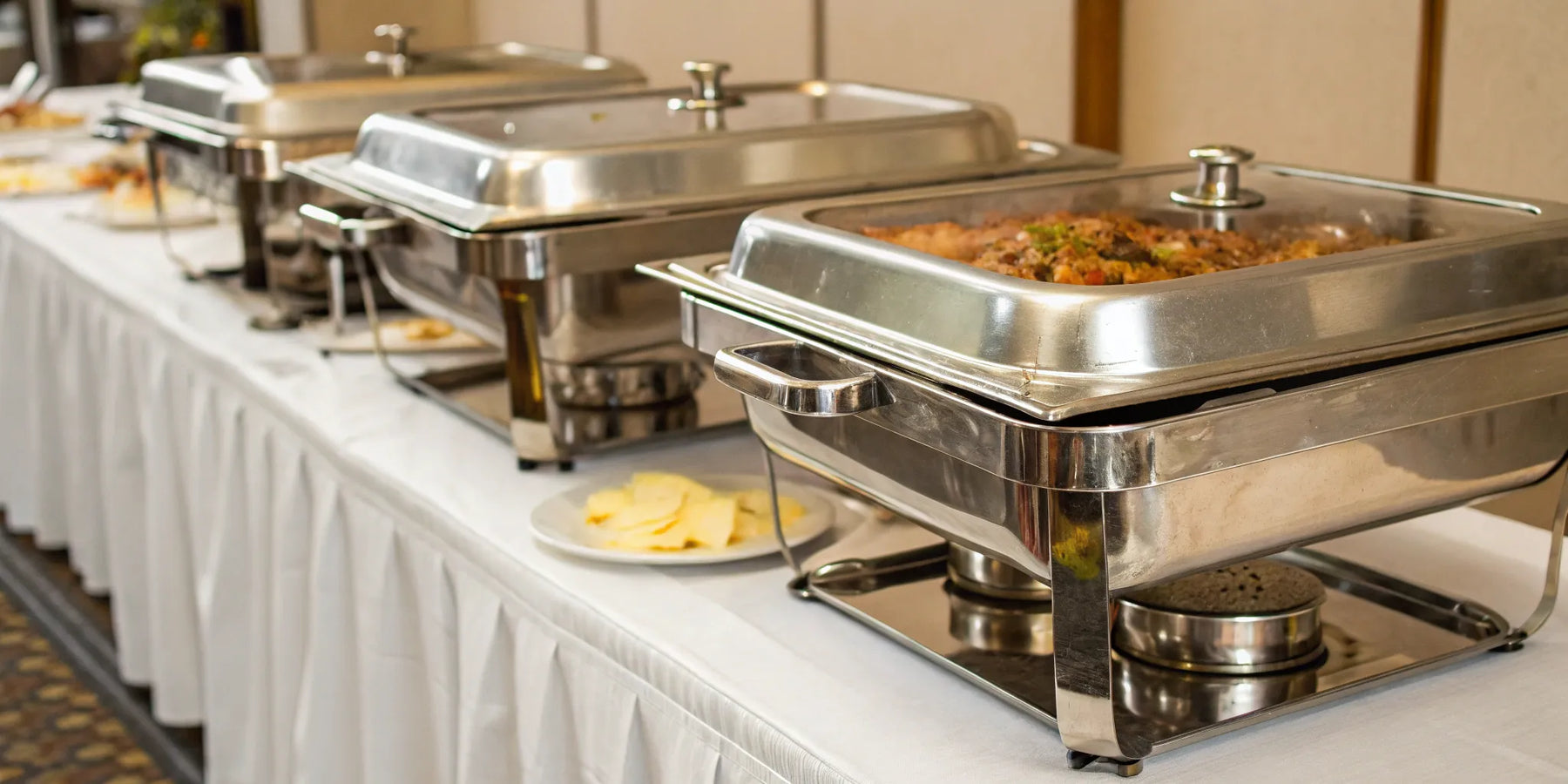 Restaurant chafing dishes maintain ideal food temperatures for buffets.
