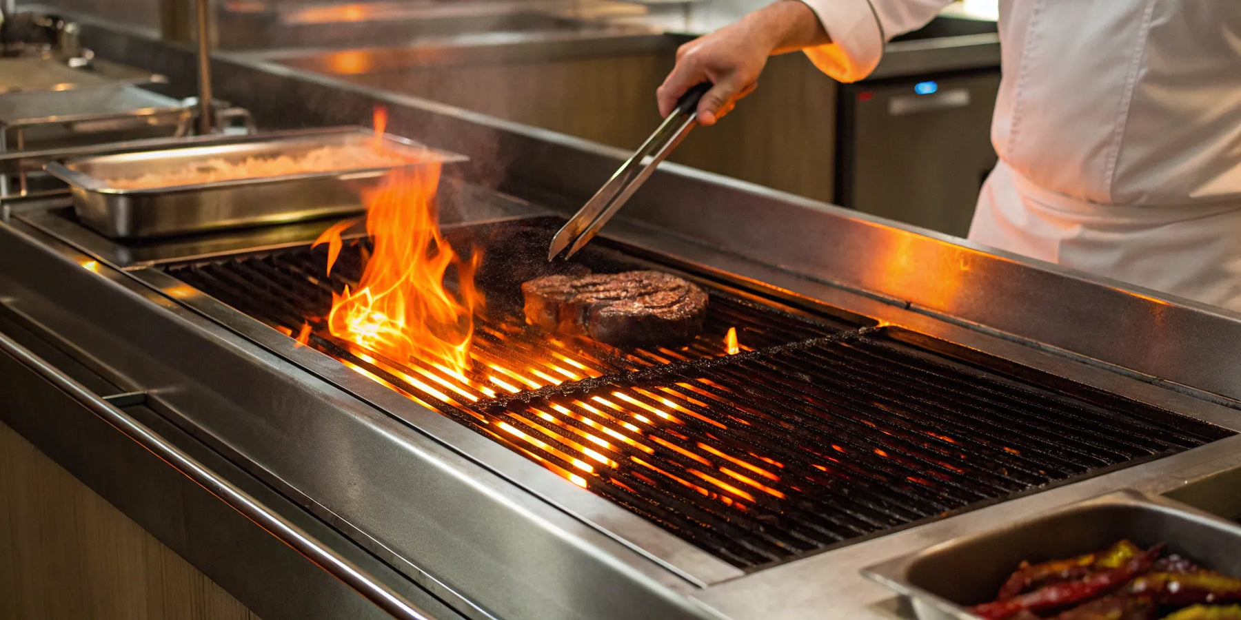 Atosa radiant char broiler grilling steak.