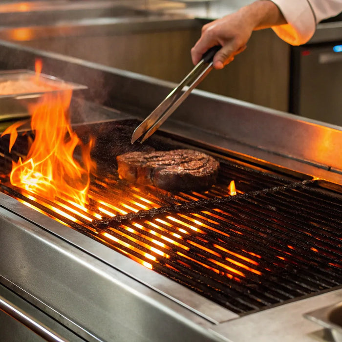 Atosa radiant char broiler grilling steak.