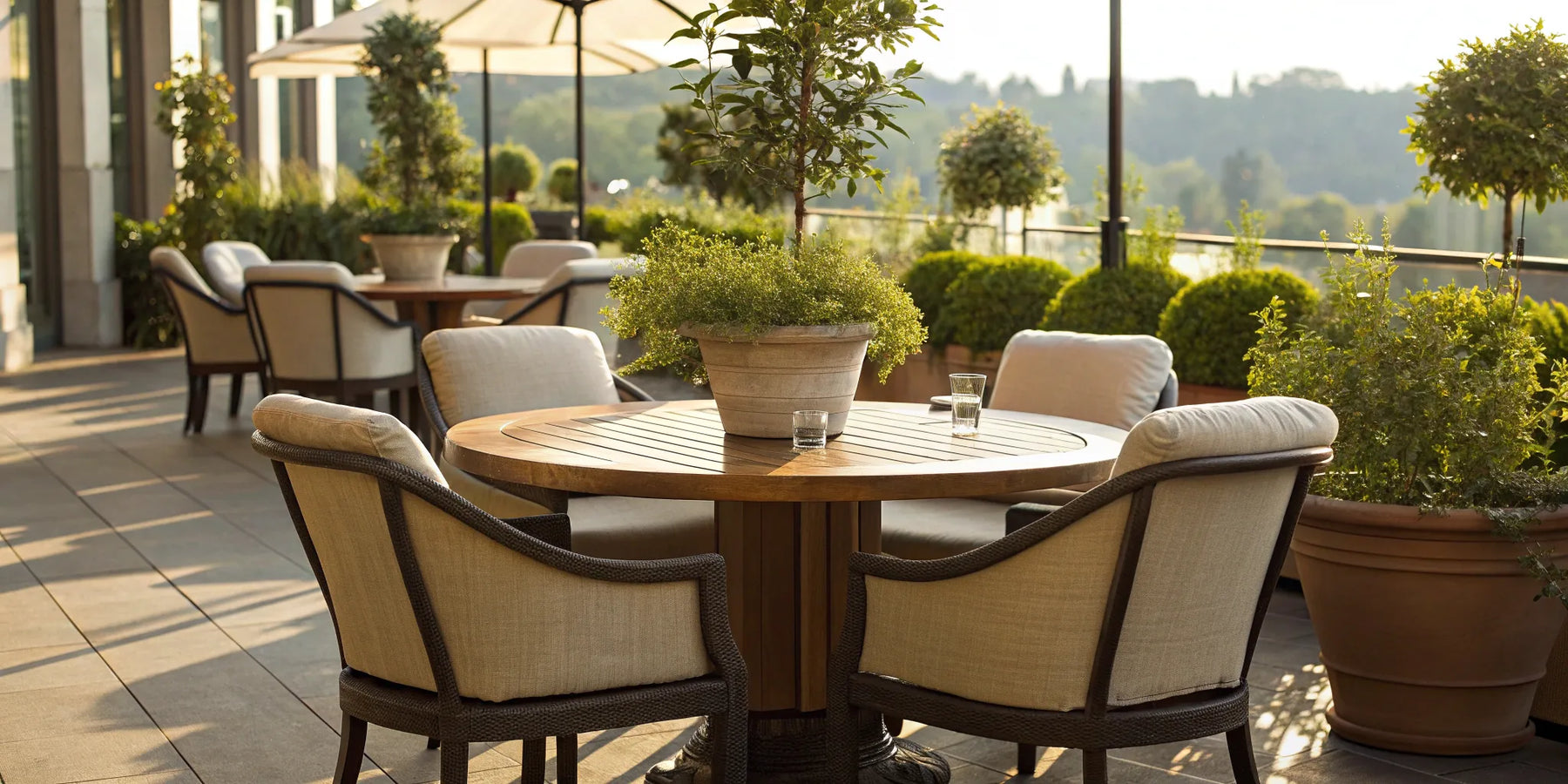 Round outdoor chair with cushions in a sunlit space.