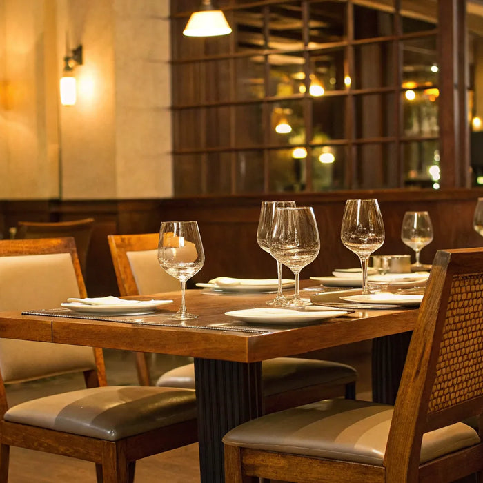 Restaurant furniture: Tables, chairs, and glassware.