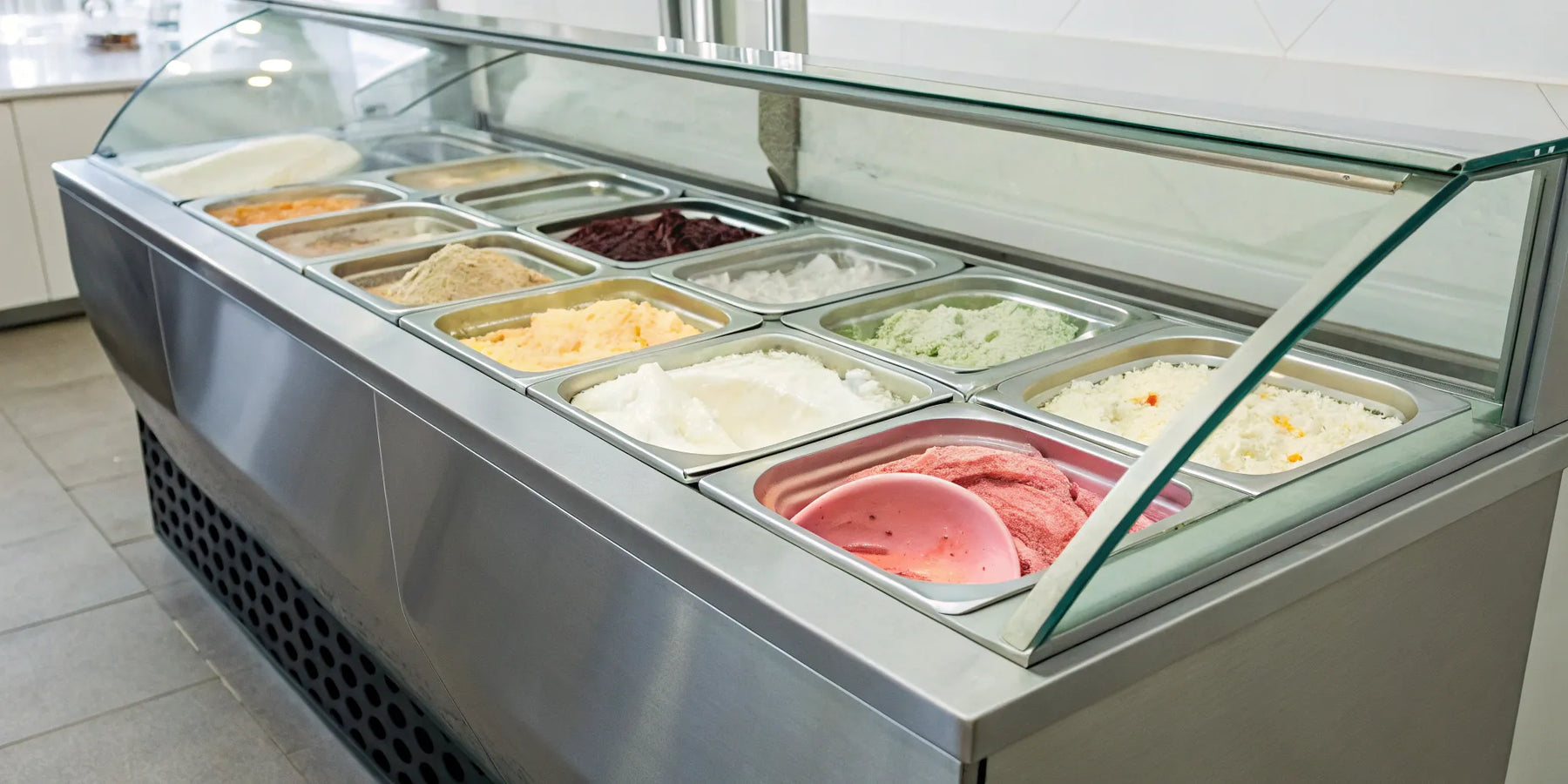 Commercial ice cream display freezer for sale with tubs of colorful ice cream.