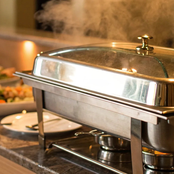 A countertop propane food warmer uses steam to keep buffet food hot.