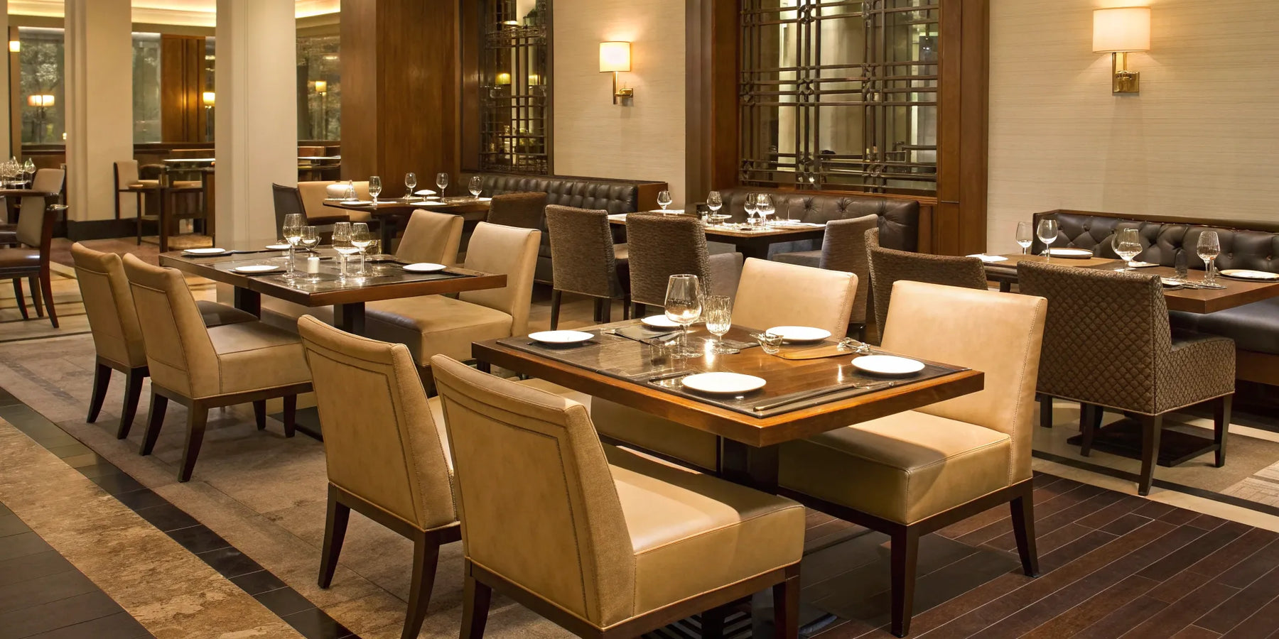 Modern restaurant chairs and tables for sale set up for a commercial dining room.